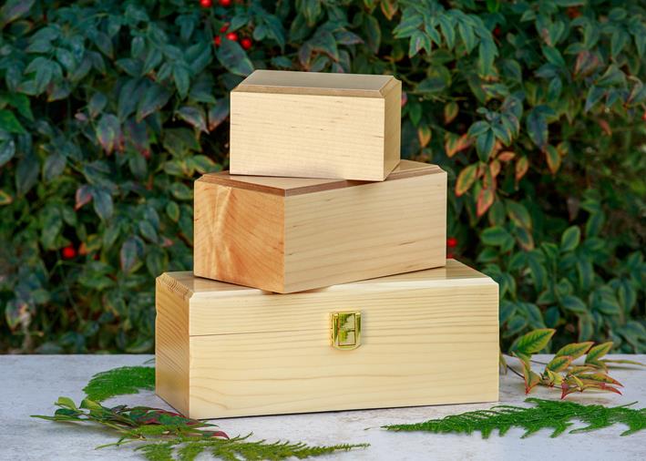three wooden chests one on top of the other